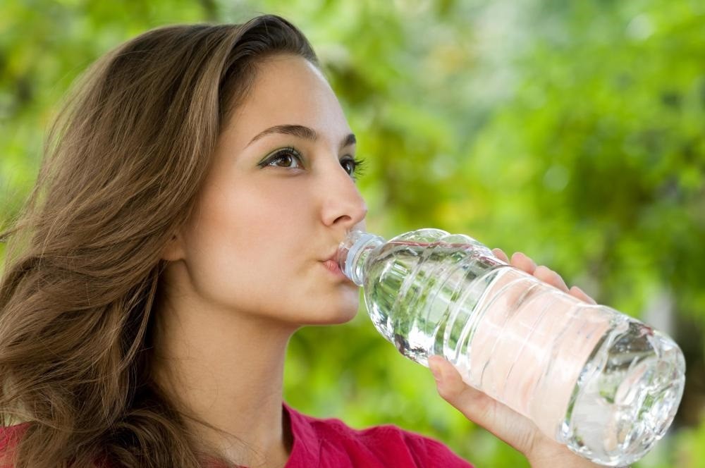 woman-drinking-bottle-water