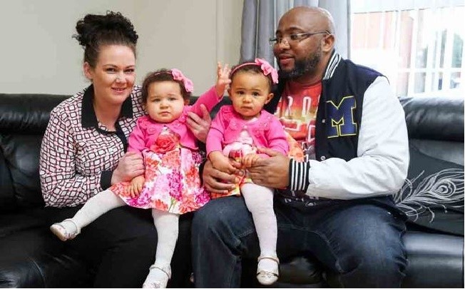 The Twins With Their Parents
