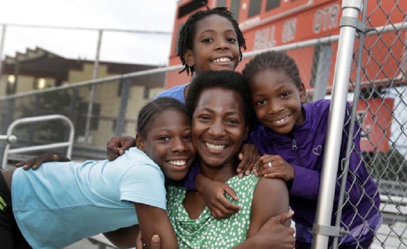 The three Homeless Sisters pose with mum