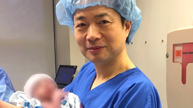 Dr John Zhang holding the 3 DNA baby boy